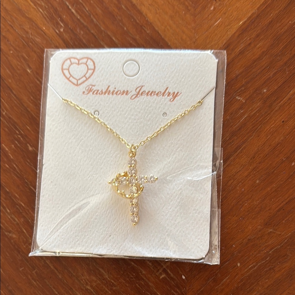 Goldtone cross necklace 
Nickle free